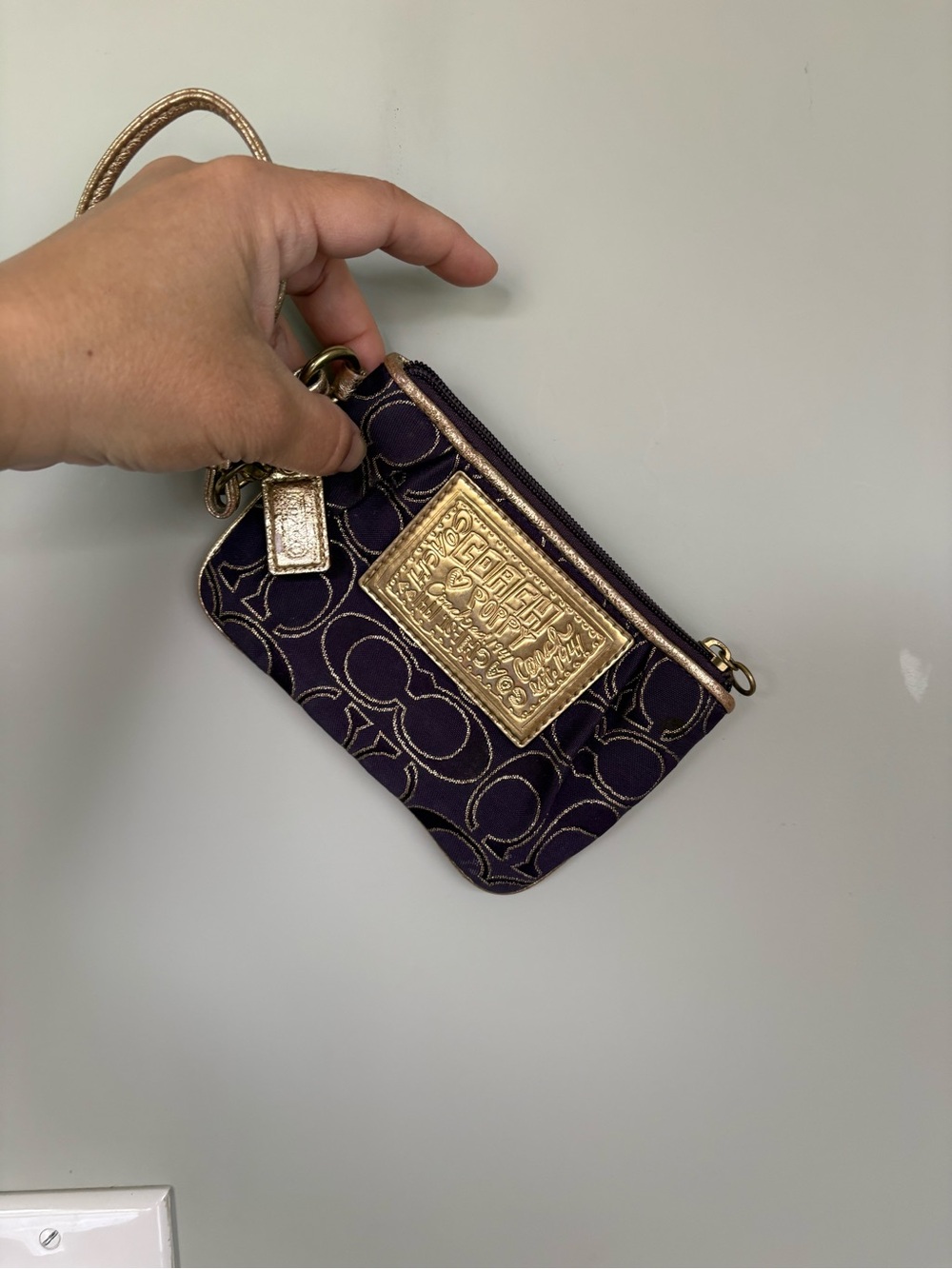 Rare Y2K-era Coach Poppy wristlet in a rich deep plum/purple signature jacquard